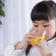 Child drinking glass of juice